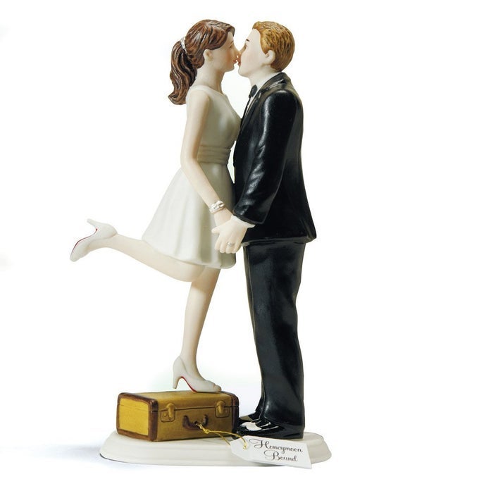 A KISS AND WERE OFF FIGURINE