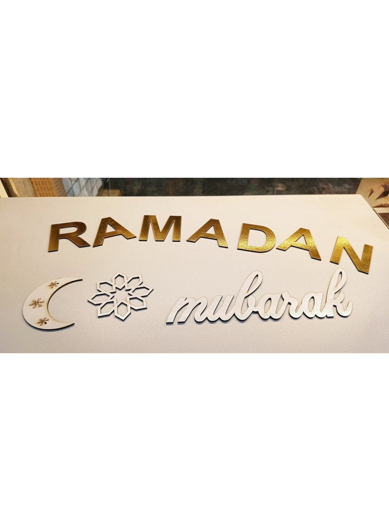 A set of "Ramadan Mubarak" words, crescent moon, and star in wooden material that adheres with double-sided tape to any decor. Available in the colors shown in the pictures: white, black, and gold.