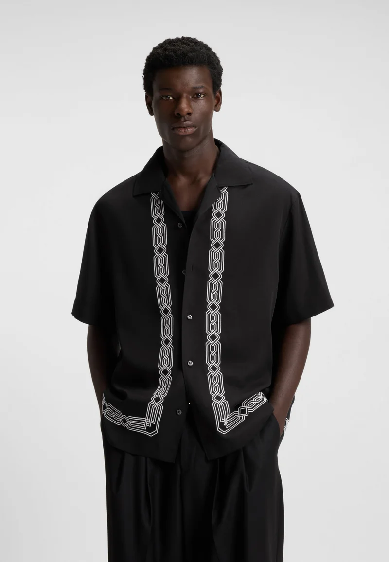 Oversized-fit shirt with embroidered pattern