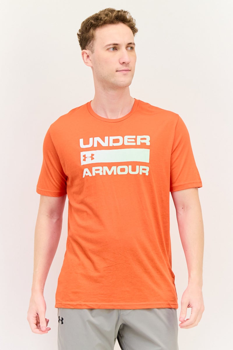UNDER ARMOUR تي شيرت رجالي فضفاض بأكمام قصيرة للخارج، كورال - Image 1