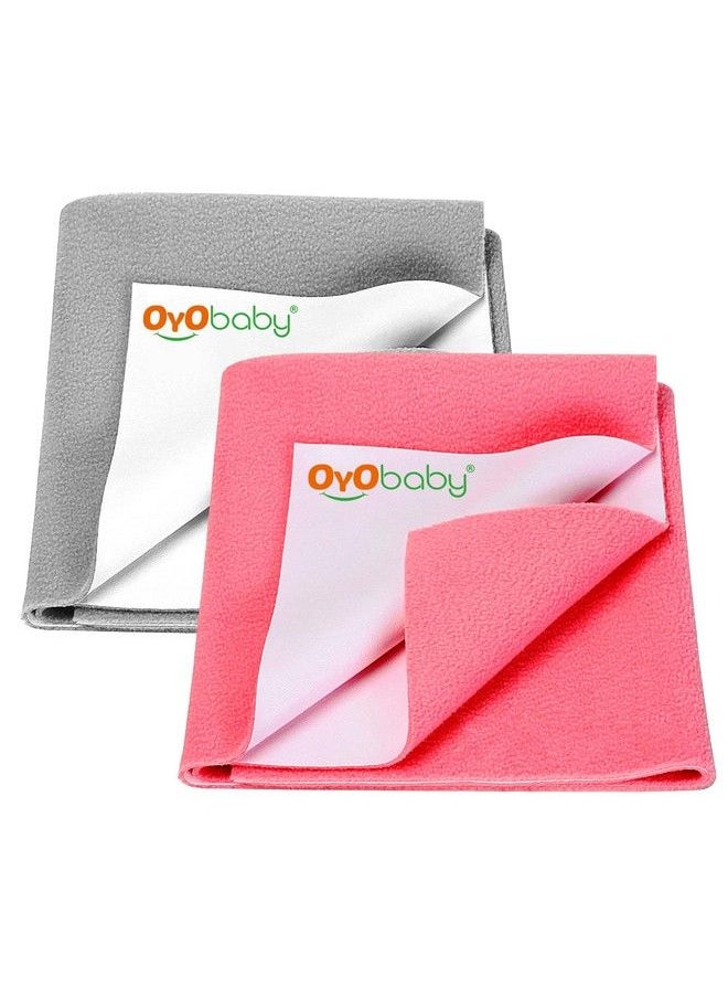 OYO BABY حماية سرير الأطفال المقاومة للماءSheets جافة للأطفال حديثي الولادة حصائر قابلة لإعادة الاستخدام ، هدايا للسرير و السلة الصغيرة 70X50 (رمادي + وردي سالمون)  - Image 1