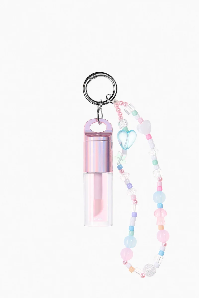 اتش اند ام زيت شفاه بتصميم علاقة مفاتيح