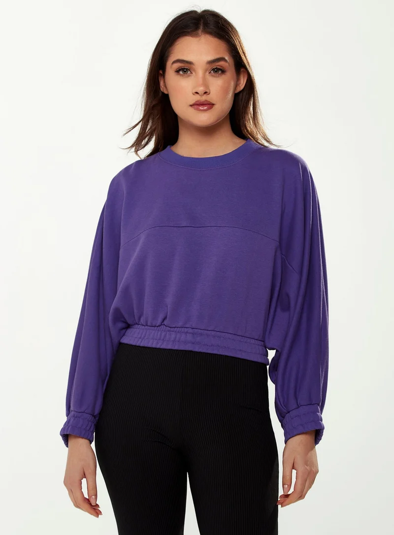 Liquorish Cropped Sweatshirt in Purple