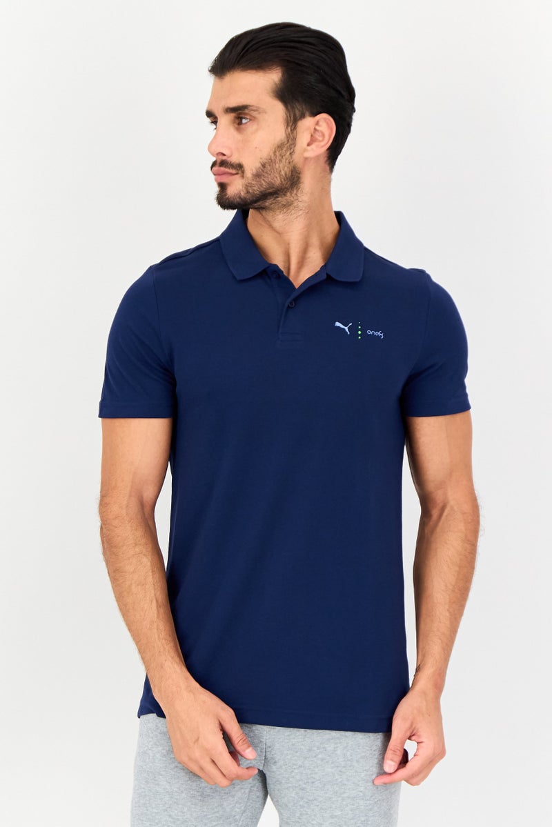 PUMA قميص بولو قصير الأكمام للرجال من One8 بتصميم ضيق مع شعار العلامة التجارية، أزرق داكن - Image 1