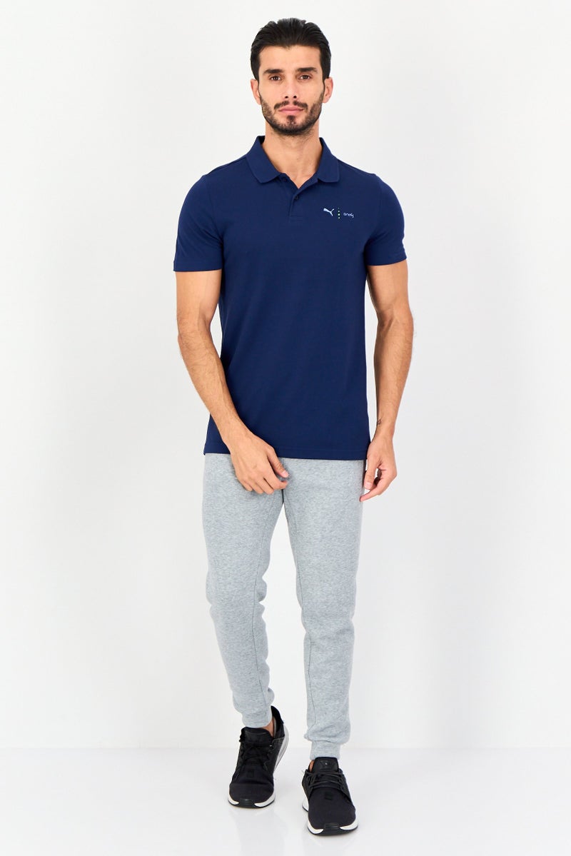 PUMA قميص بولو قصير الأكمام للرجال من One8 بتصميم ضيق مع شعار العلامة التجارية، أزرق داكن - Image 4