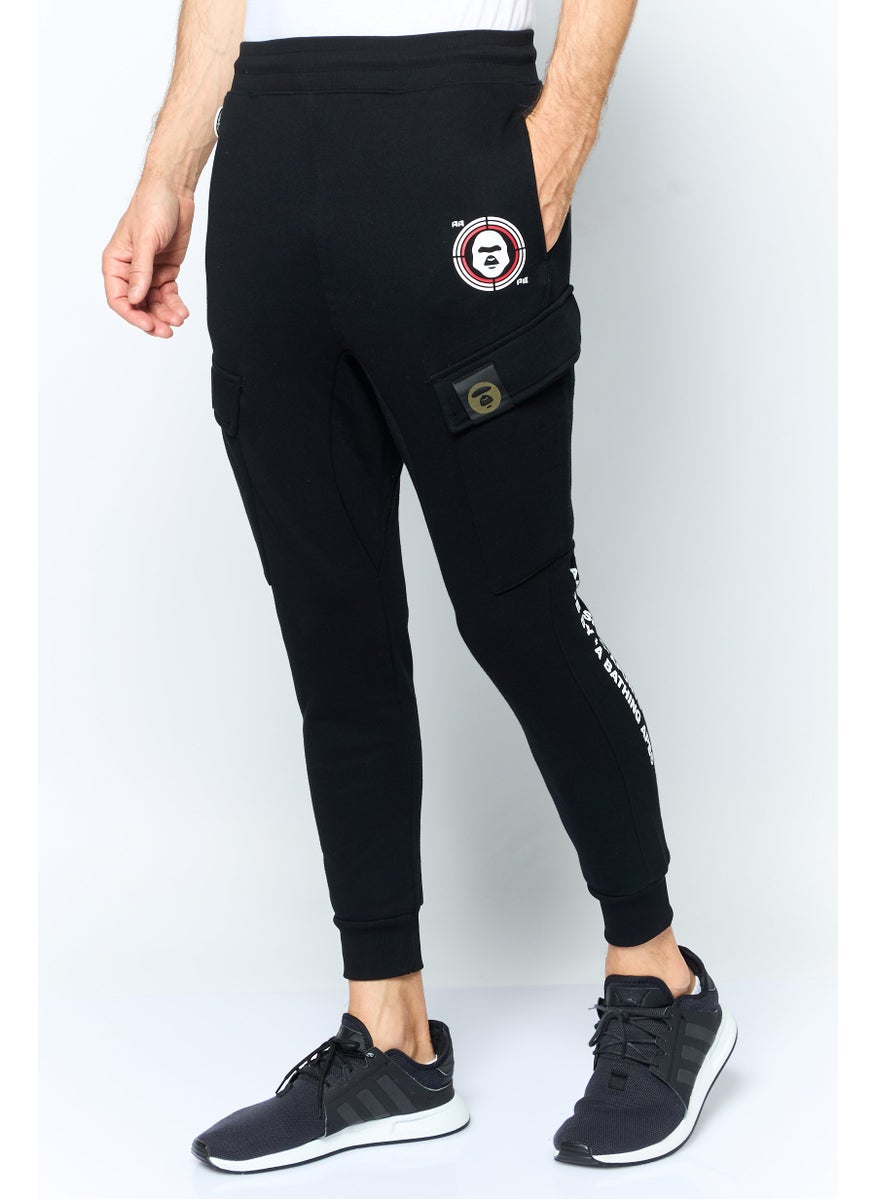 Aape By A Bathing Ape - Men Jogger Fit Graphic Print Cargo Pants, Black - Image 1
