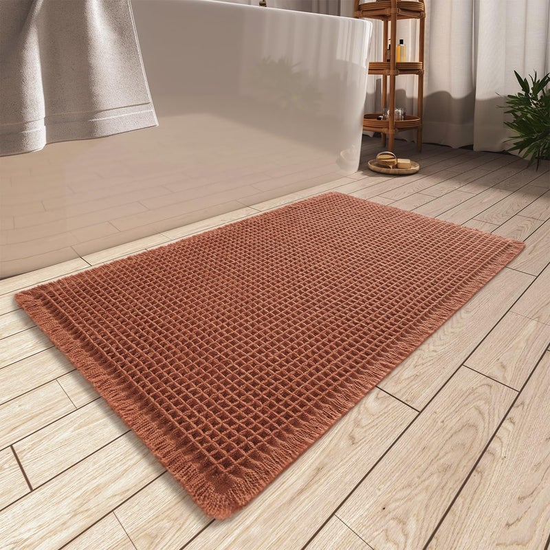 AMOAMI Upgraded Waffle Bath Mat, Super Absorbent Non Slip Bath Mats for Bathroom Floor, Machine Washable Bathroom Rugs with Tassels, Rubber Backed Bathroom Mats, Ultra Soft, 20" x 32", Dirty Orange - Image 1