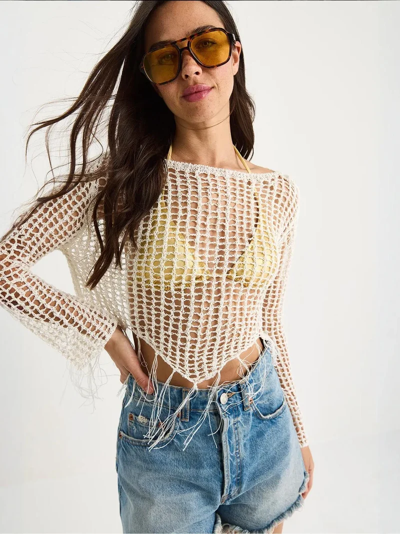 بيانكو لوتشي بلوزة قصيرة مكشكشة بياقة هالتر من لوتشي بنسيج بارز