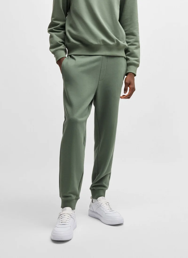 هوجو Cotton-terry tracksuit bottoms with logo print