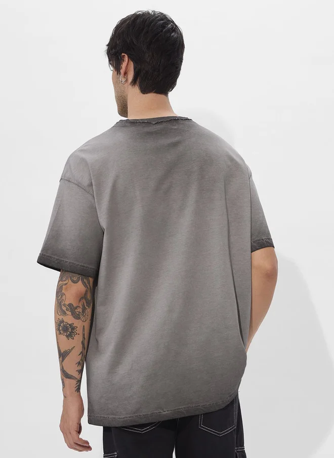 The Souled Store  The Souled Store Men's Oversized Grey Cotton T-Shirt with Graphic Print  | Best Price UAE