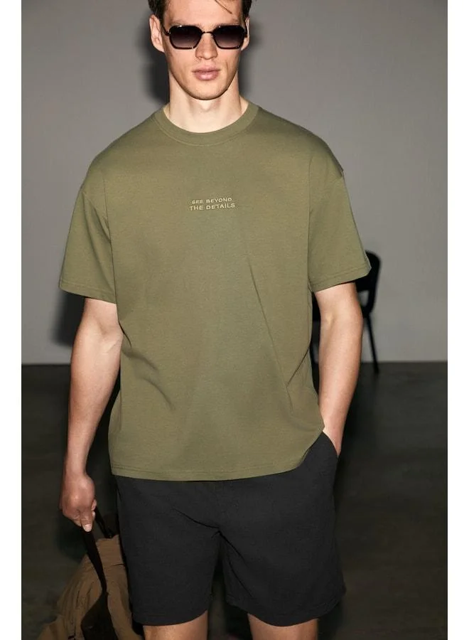 Grimelange VITO Men's 100% Organic Cotton T-Shirt with Embroidered Text Details, Oversized Loose Fit, Short Sleeve, Dark Khaki.
