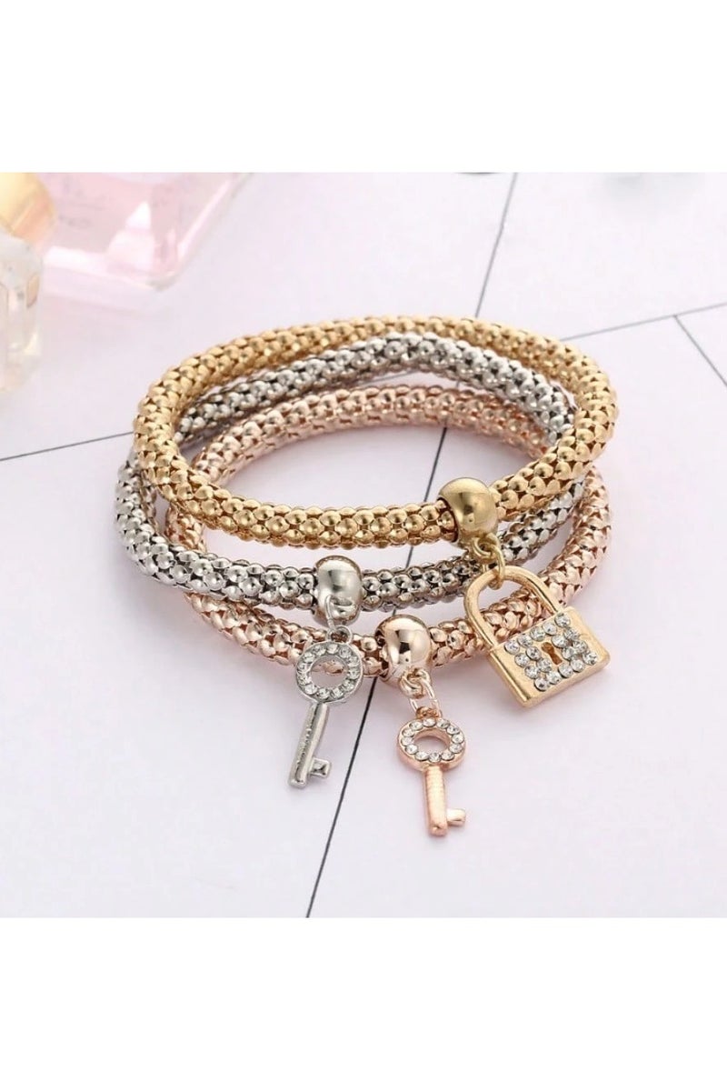 Women's accessory – a set of 3 bracelets in different colors with lock and key charms. Perfect as a gift for birthdays, graduations, Valentine's Day, and all special occasions.  - Image 2