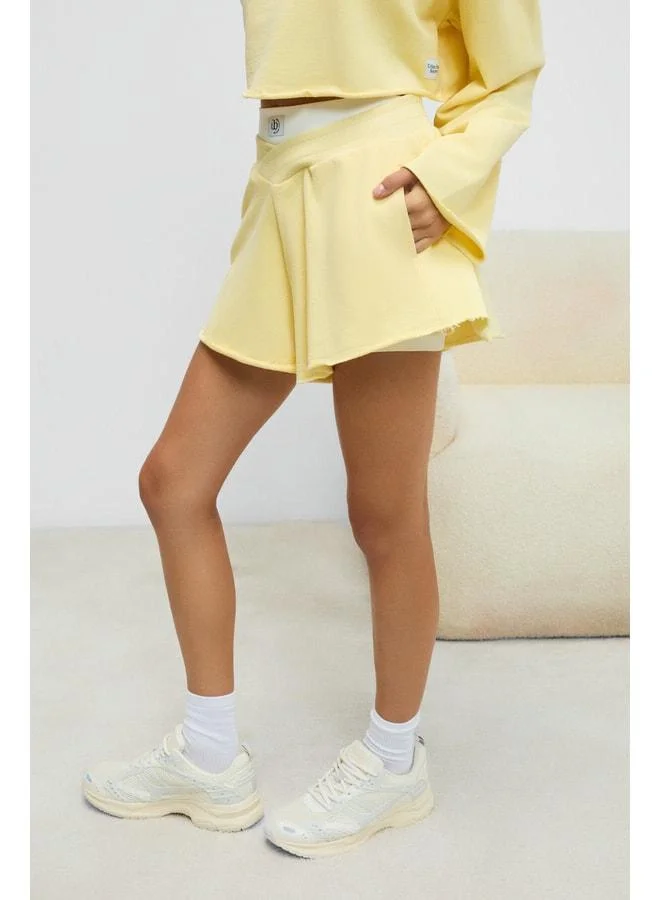 Urban Beat  HELOSIE Women's Asymmetric Belted-Waist Oversized Yellow Shorts. for Women | Best Price UAE