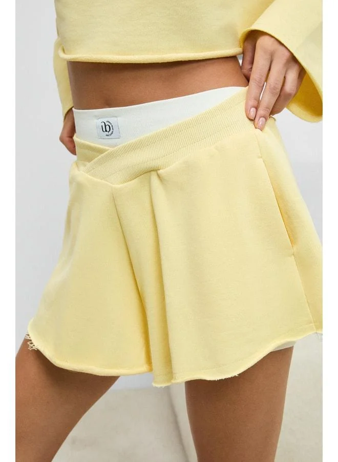 Urban Beat HELOSIE Women's Asymmetric Belted-Waist Oversized Yellow Shorts.