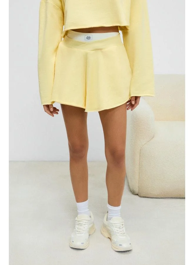 Urban Beat HELOSIE Women's Asymmetric Belted-Waist Oversized Yellow Shorts.