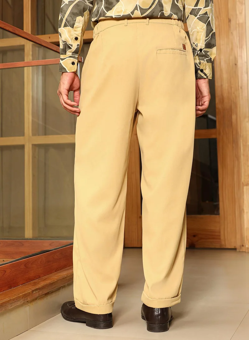 CAHOOT  Men Pleated-Twill Tailored Trousers | Mid-Rise , Side Elasticated Stretch Waist | Half-Button , Cuffed-Straight Hem | Solid Twill | Woven Fabric For Casual & Office Wear | Buff Beige for Men | Best Price UAE
