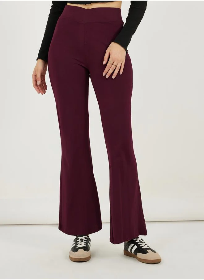 Styli Solid Criss-Cross Waistband Fit & Flare Leggings