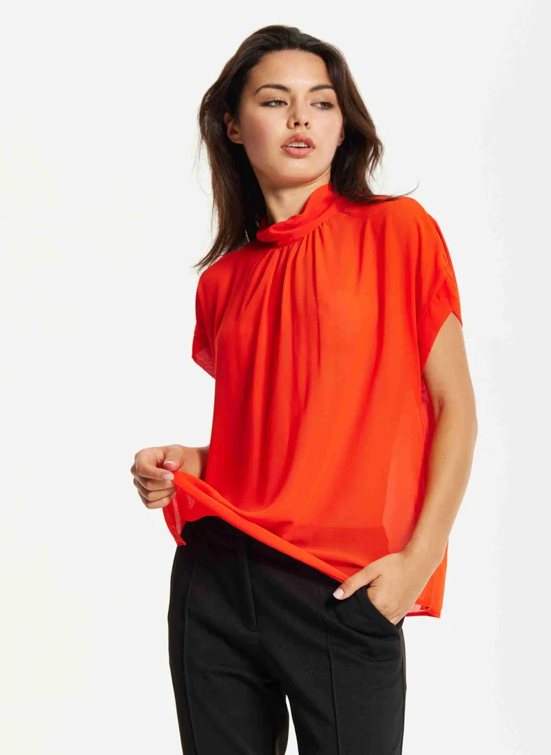 Liquorish Orange High Neck Tie Back Top