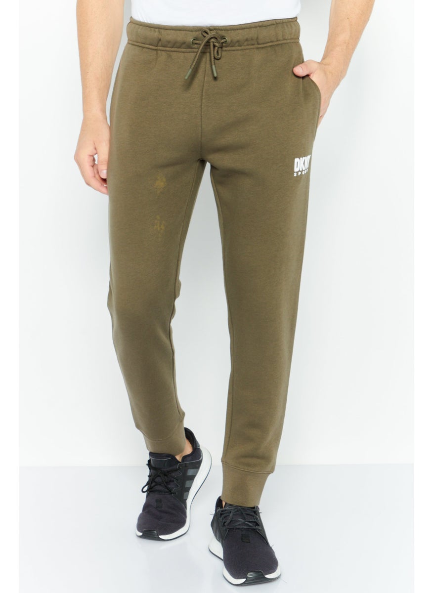 DKNY Sport Men Sportswear Fit Brand Logo Outdoor Sweatpants, Olive  - Image 1