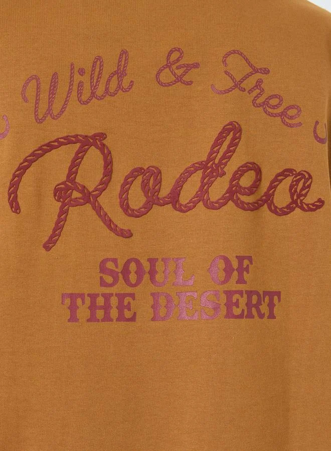 Styli  Men Brown Embroidered Slogan Oversized T-Shirt for Men | Best Price UAE