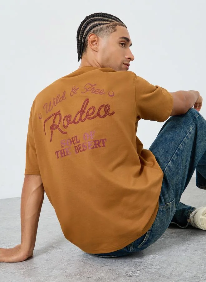 Styli  Men Brown Embroidered Slogan Oversized T-Shirt for Men | Best Price UAE