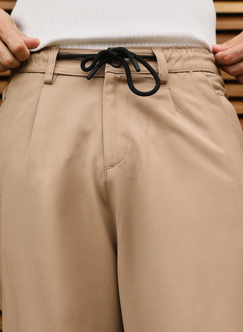 CAHOOT  Men Pleated Relaxed Trousers | Mid-Rise, Side-Elasticaed Stretch | Drawstring , Straight Hem | Solid Plain | Woven Fabric For Casual & Street Wear | Khaki Beige for Men | Best Price UAE