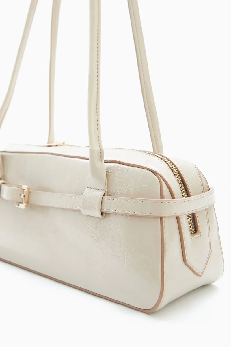 Wecre8 Beige Elongated Shoulder Bag by WECRE8