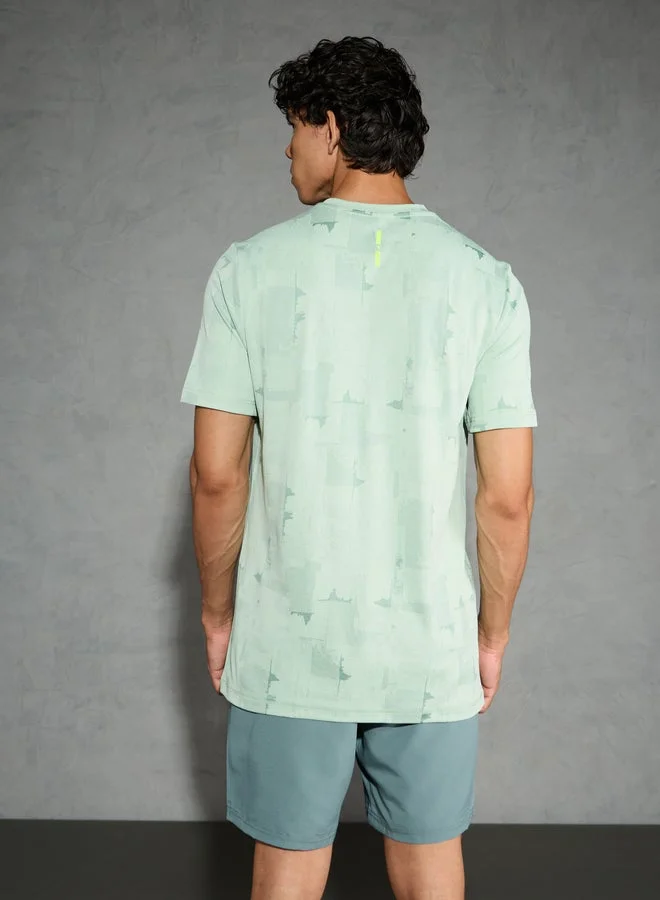 تكنوسبورت تيشيرت رجالي تكنوسبورت بقصة ضيقة وياقة دائرية بنقشة الجاكار