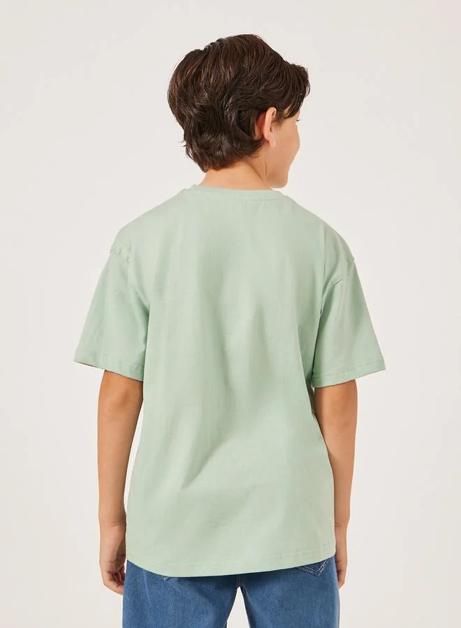 Styli Solid Oversized T-Shirt with Badge Detail