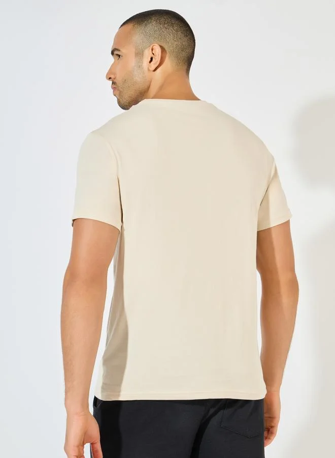 Styli Styli Crew Neck Regular Fit T-Shirt with Silicon Badge