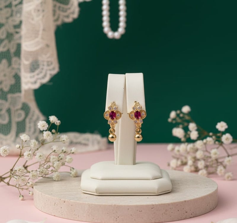 A delicate gold-plated hoop featuring a crimson red centerpiece, surrounded by the sparkle of dazzling white zircon stones. The allure is completed with a small spherical pendant. - Image 5