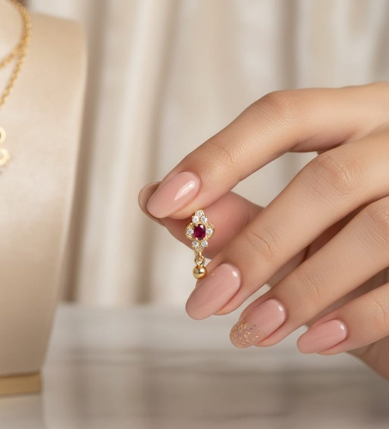 A delicate gold-plated hoop featuring a crimson red centerpiece, surrounded by the sparkle of dazzling white zircon stones. The allure is completed with a small spherical pendant. - Image 4