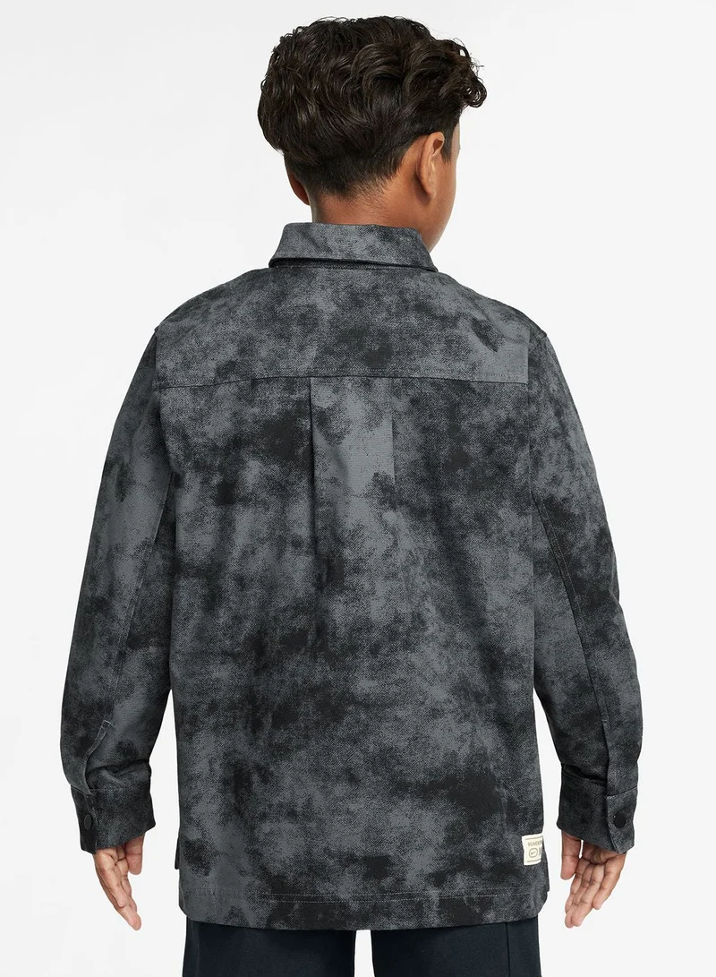 نايكي قميص رجالي بأزرار من مترو جراوند للشباب