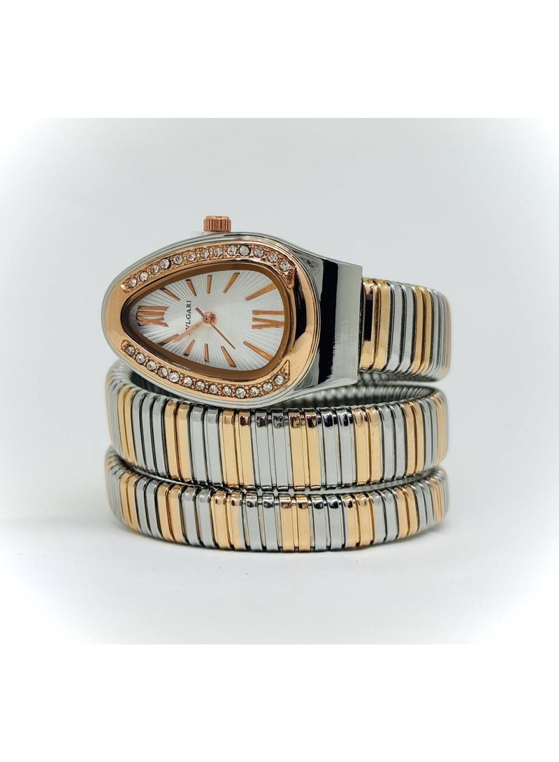 بولغاري ساعة يد حريمي تري تون سيلفر وذهبي بسوار معدني ملفوف – مينا بيضاوي بإطار فصوص