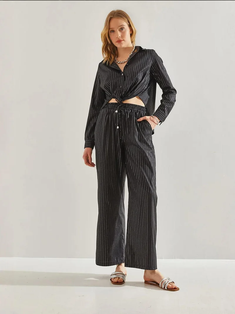 بيانكو لوتشي بنطلون واسع مخطط بخصر مطاطي ورباط من لوكسي