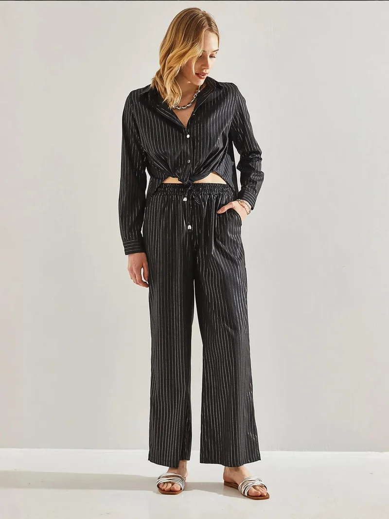 بيانكو لوتشي بنطلون واسع مخطط بخصر مطاطي ورباط من لوكسي