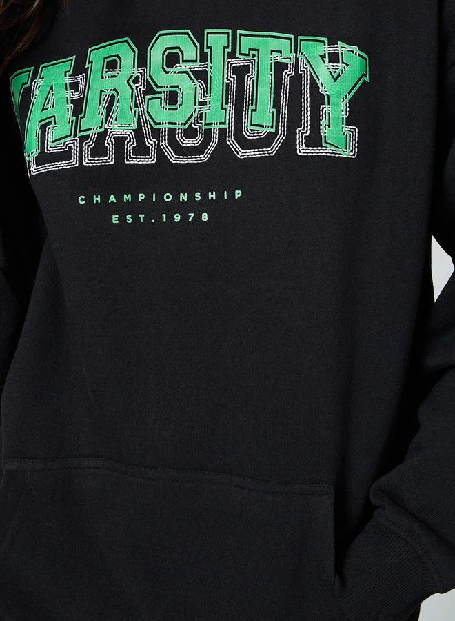 Styli Oversized Longline Slogan Embroidered Hoodie