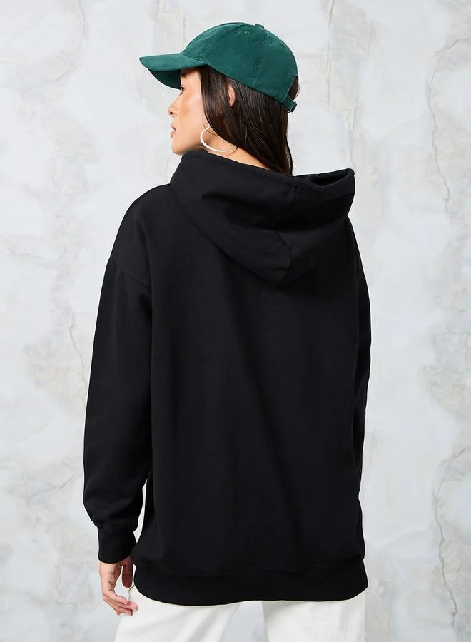 Styli Oversized Longline Slogan Embroidered Hoodie