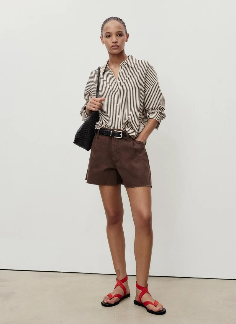 MANGO  Denim shorts with frayed hem and pleats for Women | Best Price UAE