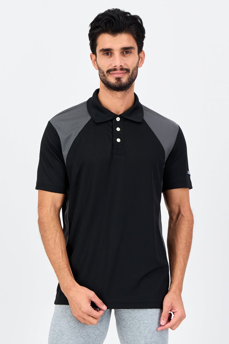PUMA Men Sportswear Fit Short Sleeve Dezire Outdoor Polo Shirt, Black - Image 1