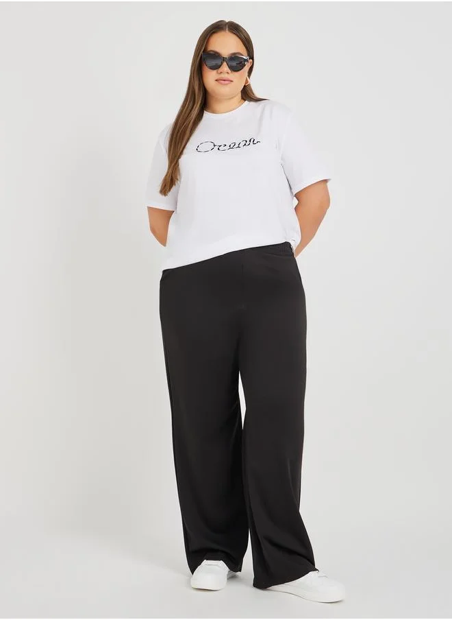 Styli Styli Plus Size Embroidered Slogan Round Neck T-Shirt