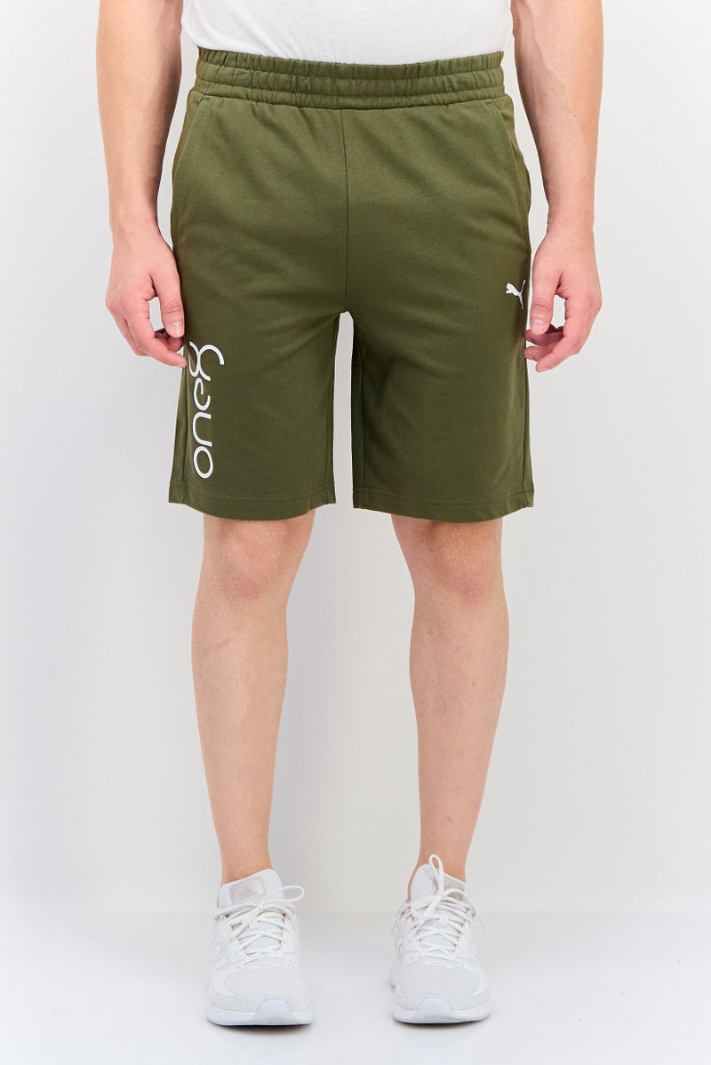 Puma x One8 Men Sportswear Fit Brand Logo Outdoor Shorts, Dark Green - Image 1