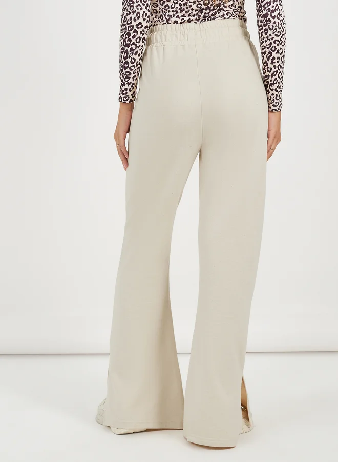 Styli Solid Drawstring Waist Flared Joggers with Side Slit