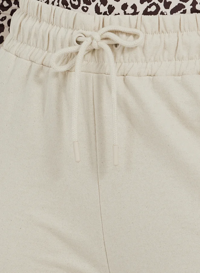Styli Solid Drawstring Waist Flared Joggers with Side Slit