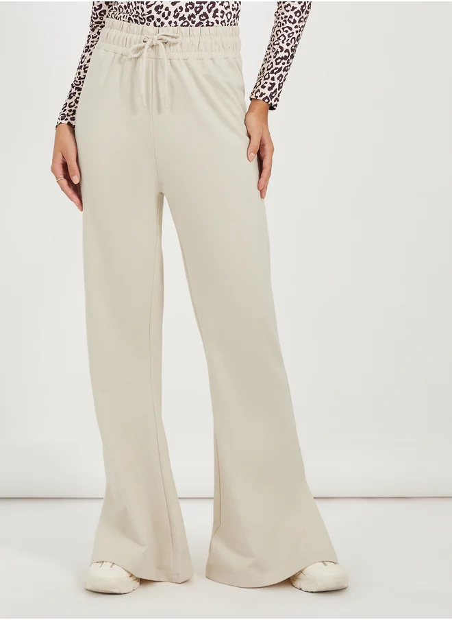 Styli Solid Drawstring Waist Flared Joggers with Side Slit
