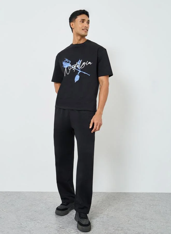ستايلي Men Black Graphic Print Oversized T-Shirt