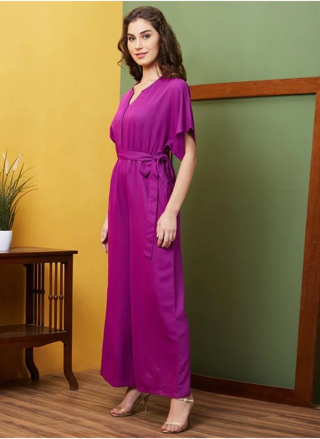 جلو باص Globus Women Purple Round Neck With V Cut & Kimono Sleeves Waist Tie-Up Longline Jumpsuit by Styli