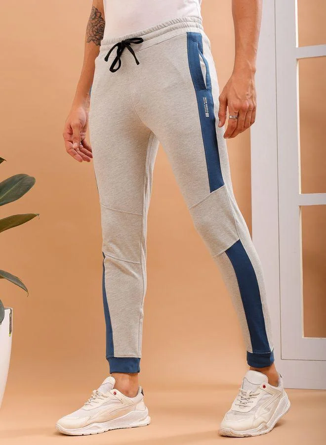 ذا انديان كراج كو Men Slim Fit Solid Mid-Rise Stretchable Knitted Jogger Trousers