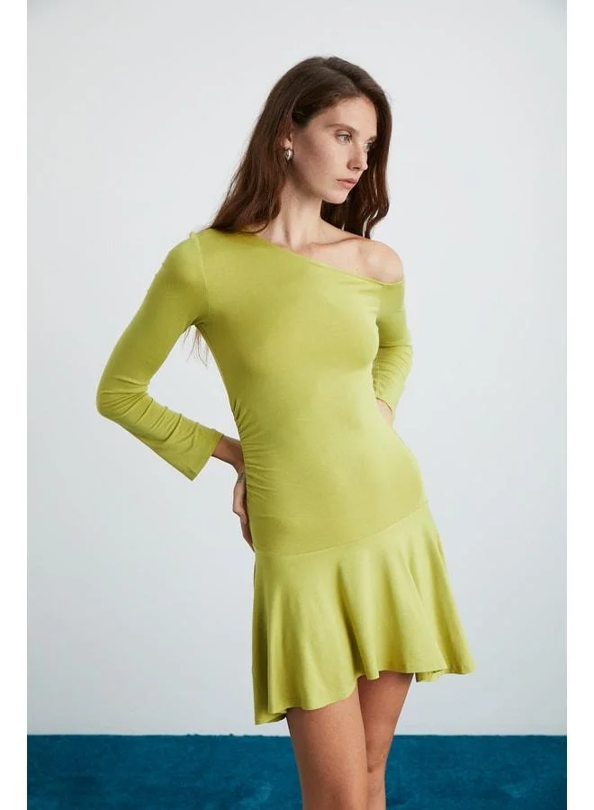 Ethiquet GLENIS Women's Viscose elastane Boat Neck Dress with a Fitted Bodice, Flared and Asymmetric Green Skirt.