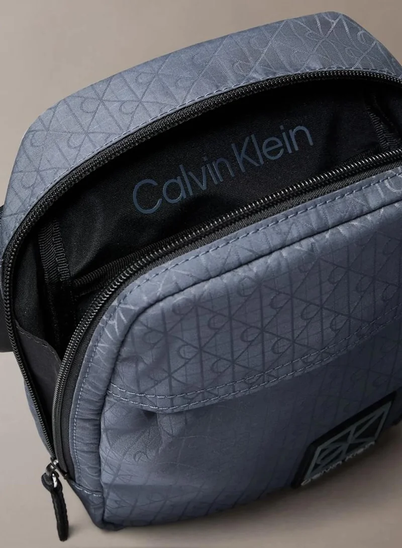 Calvin Klein SLATE BLUE AS SWATCH SENT Allover Emblem Logo Jacquard Reporter Bag for Men | Best Price UAE